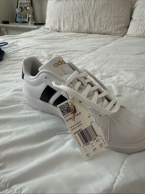 adidas White Sneakers with Black Stripes and Gold Logo